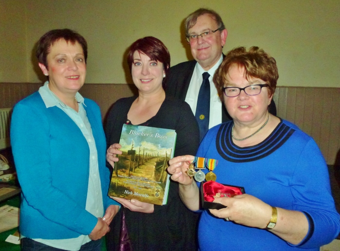 Heather Stirrat, Marie McKenna, Michael Fisher and Ruby Heasty with the three WW1 medals Photo: © Evelyn Fisher